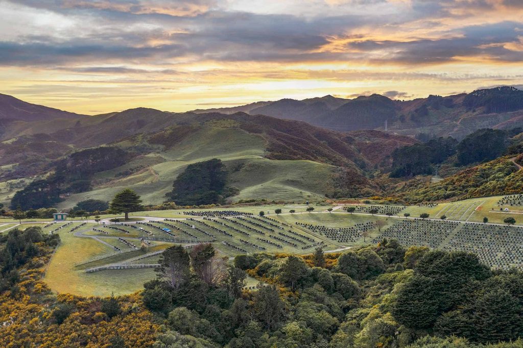 Rolling hills above a cemetery at dusk