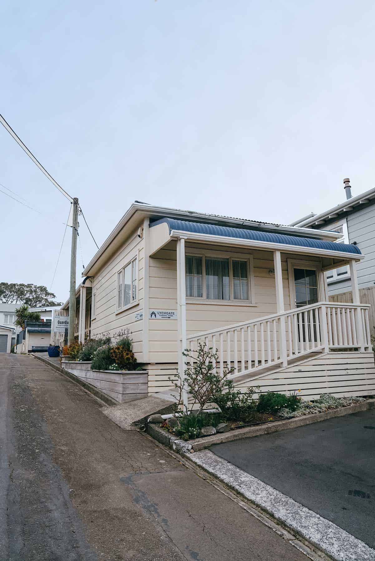 The Lychgate office at 89 Karori Road, a white weatherboard building on the street