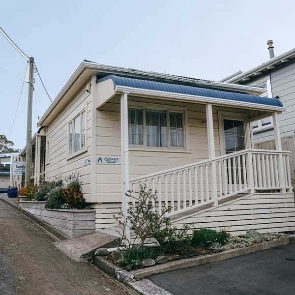 The Karori office, a white weatherboard building on Karori Road