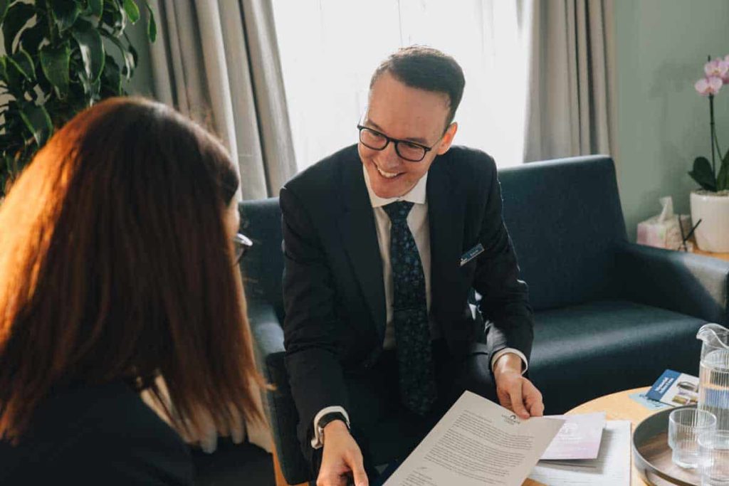 Lucas meeting with a client to talk through the arrangements