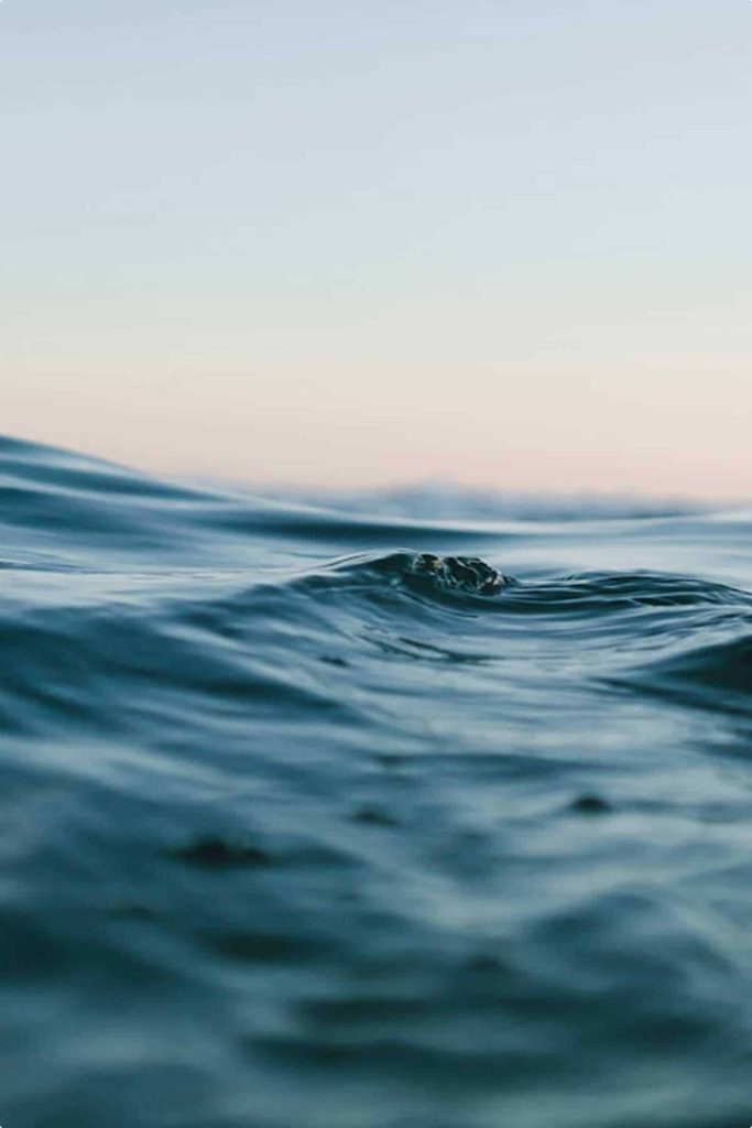 Calm sea under a pale evening sky