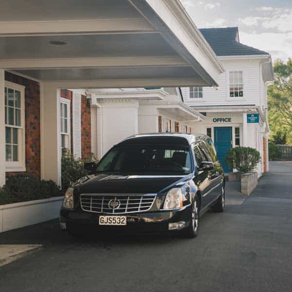 The Willis Street chapel entrance, with a Lychgate hearse under the porch